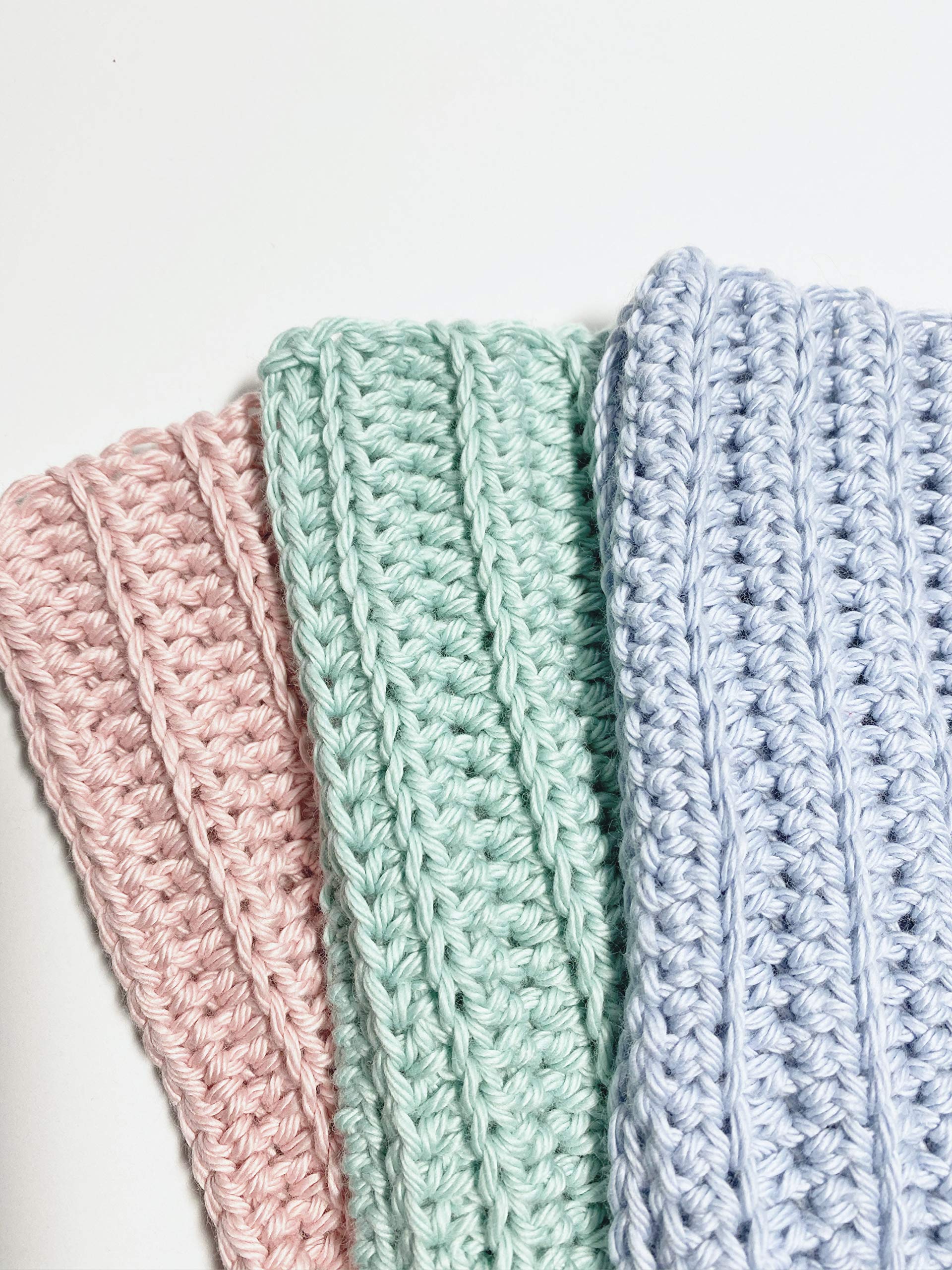 Close up blue handmade crochet washcloths 3-pack
