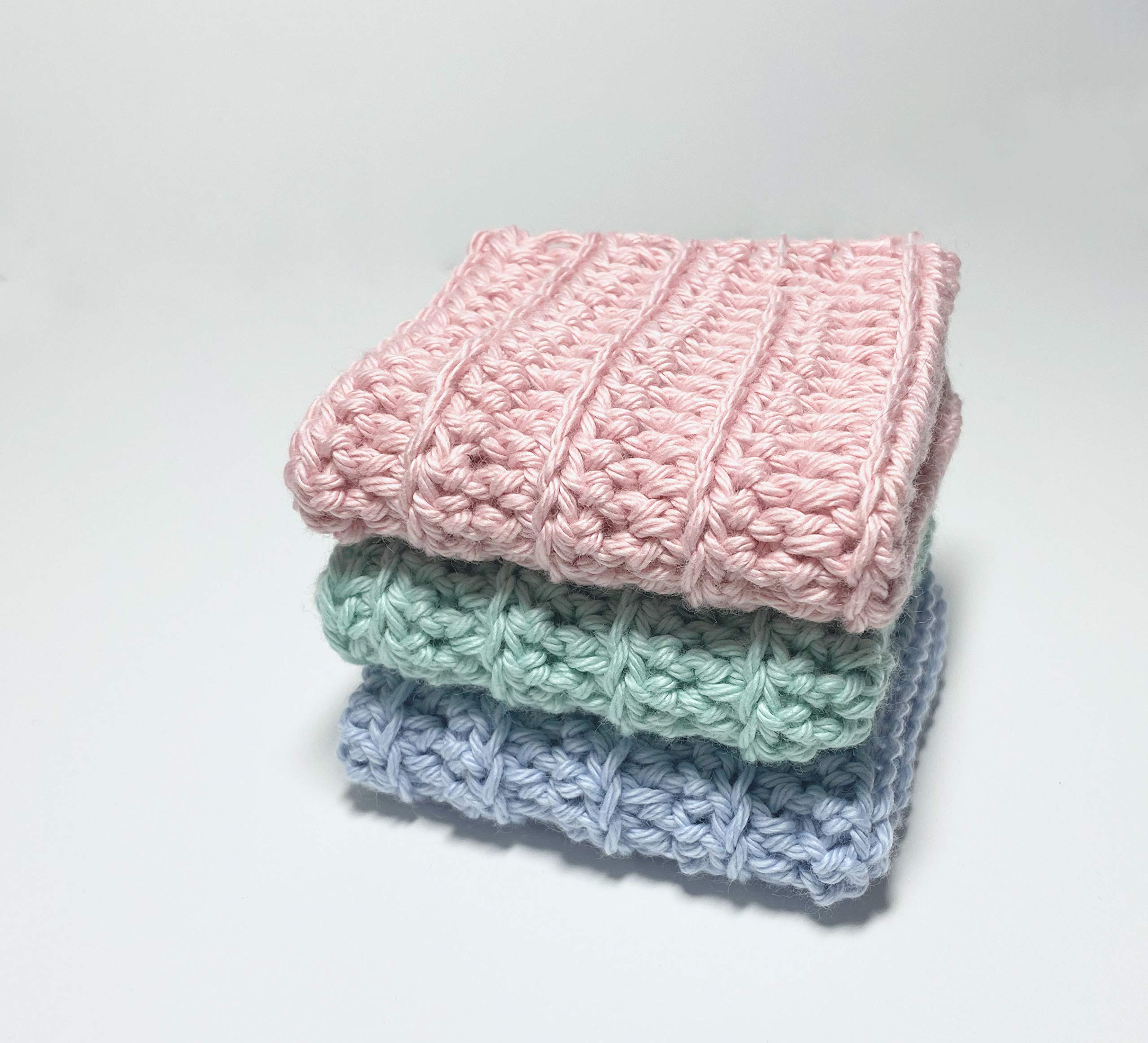 Close up pink handmade crochet washcloths 3-pack