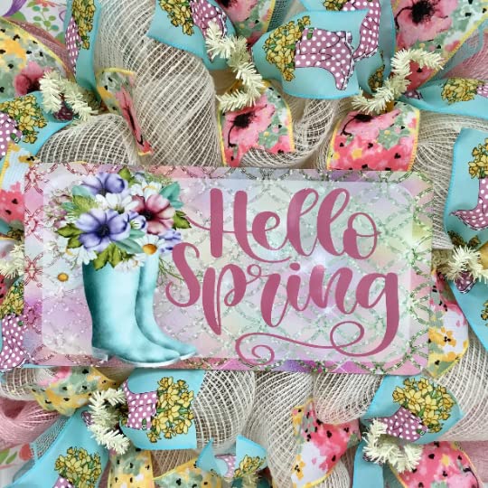 Decorative wreath featuring rain boots filled with flowers and deco mesh