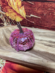 Handmade pink mosaic pumpkin used as festive fall decor