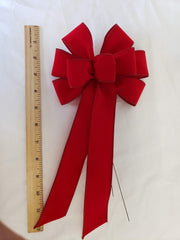 Bow measures 5-6 inches across and 10-11 inches long