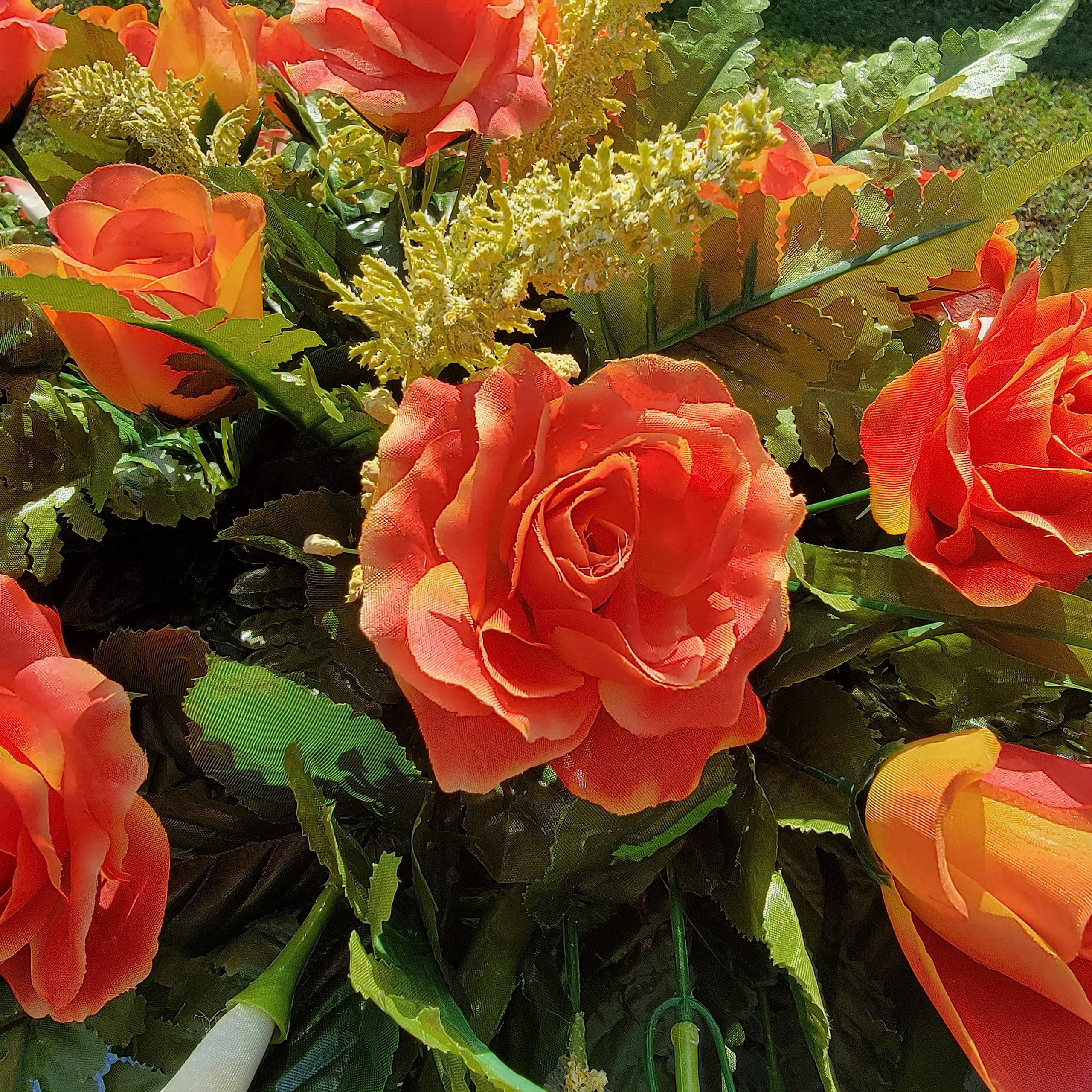 Realistic silk flowers including roses and calla lilies