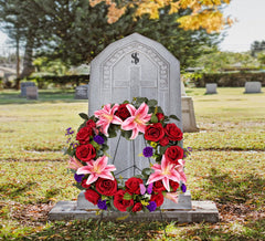 Handmade silk flowers wreath with red pink tones for graves