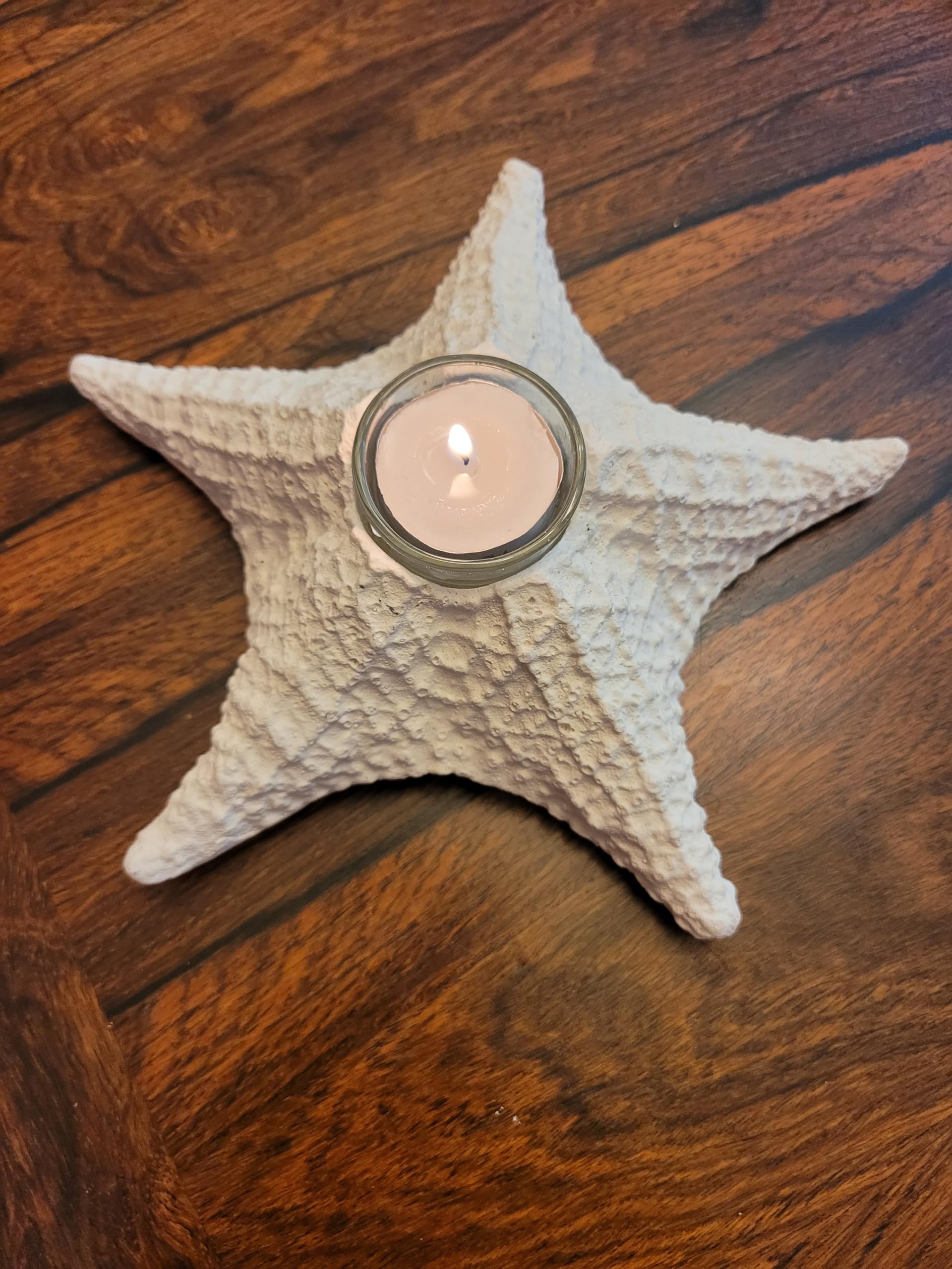 Includes one tea light candle with candle holder