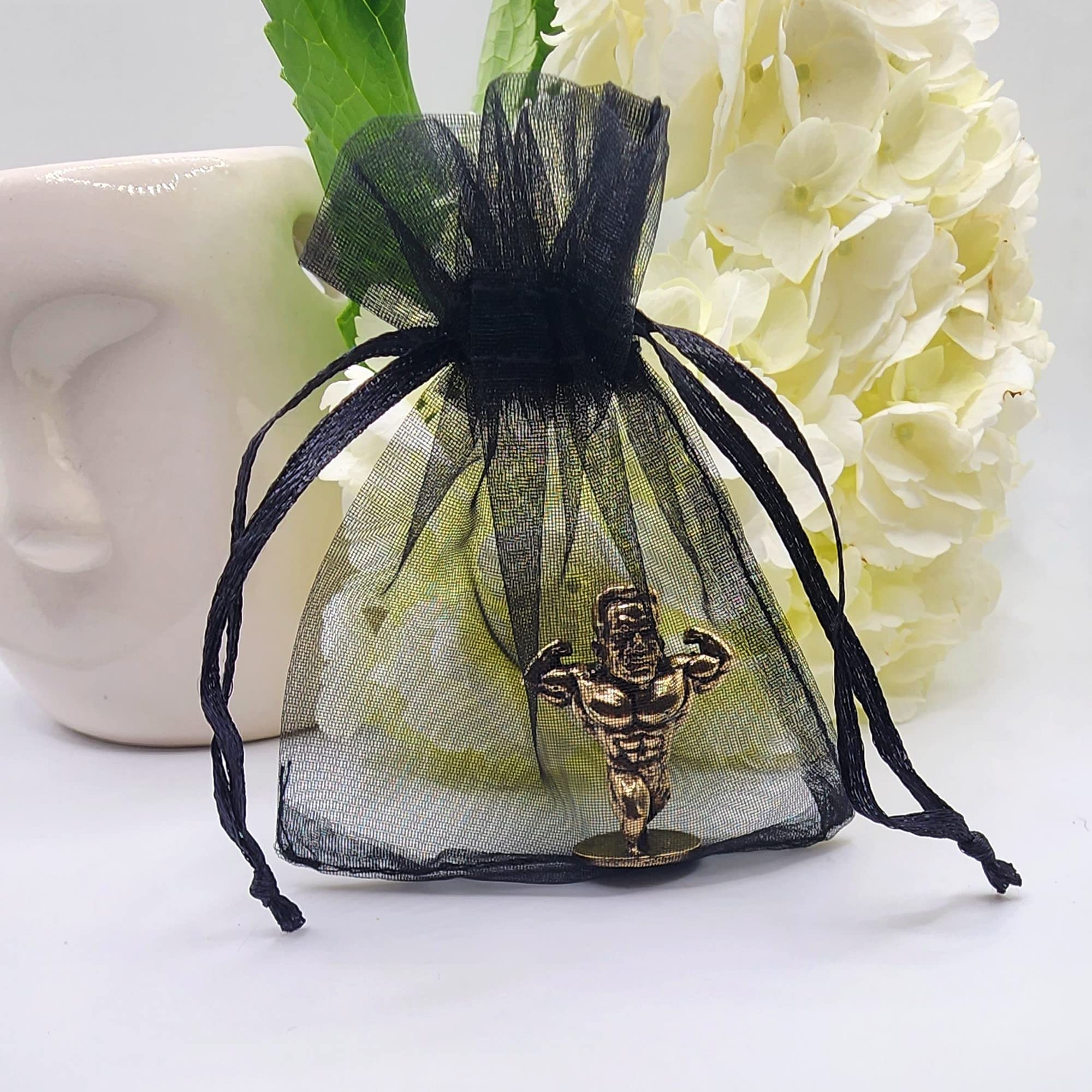 Gift-ready brass bodybuilder figurine in pouch
