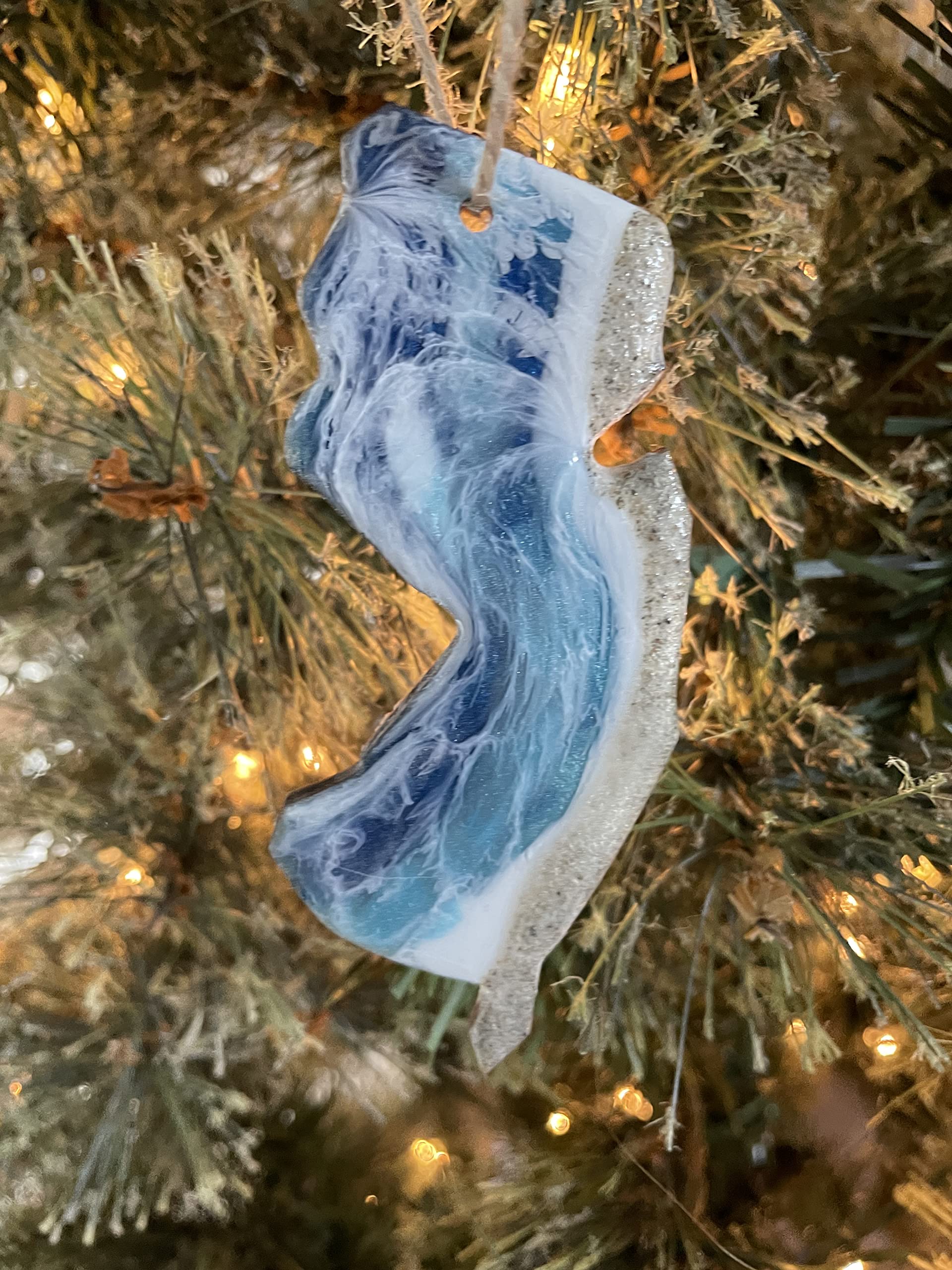 Natural wood back with minor discoloration on ornament