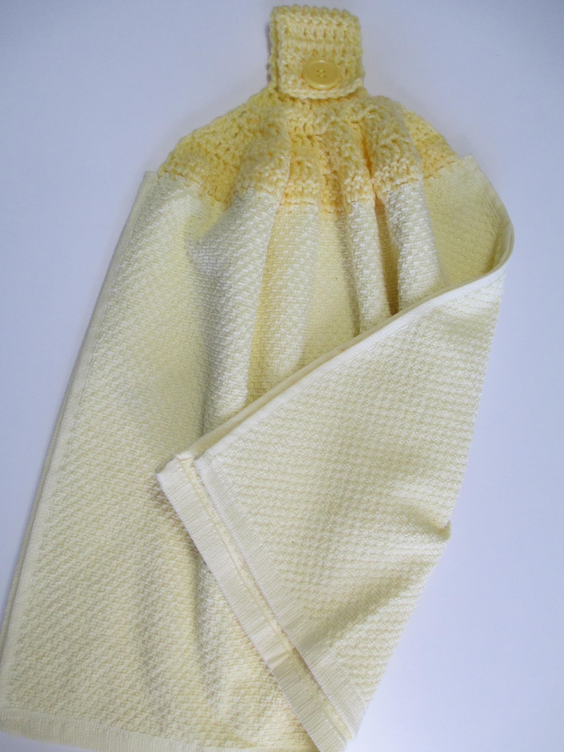 Towel with button for easy hanging
