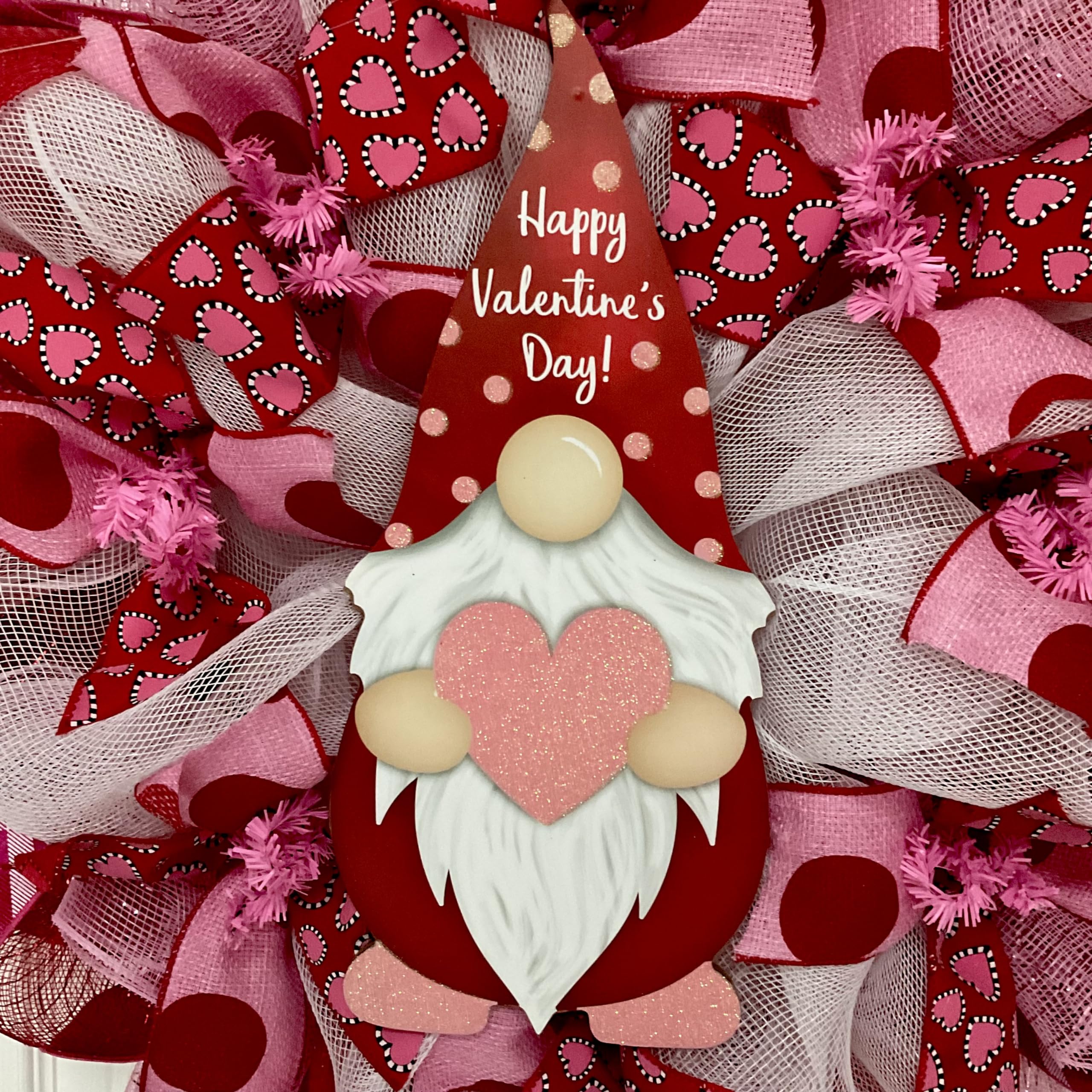 Close up of Happy Valentine's Day Gnome hat and heart ribbons