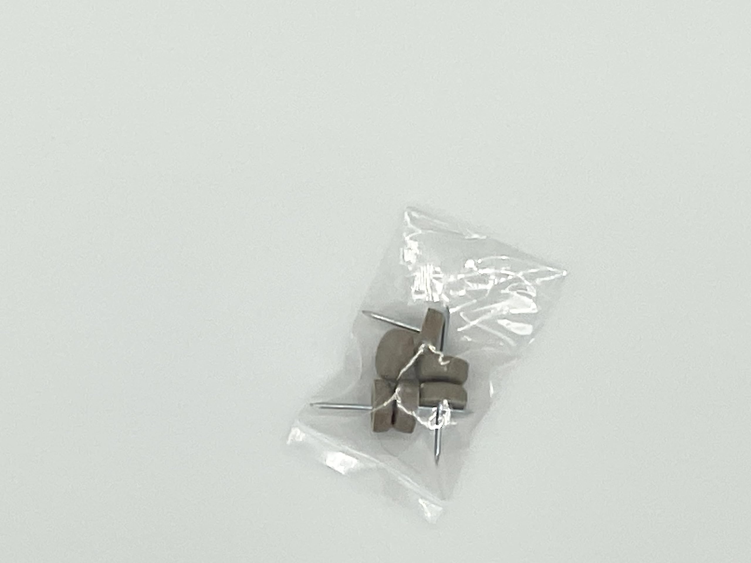 Brown plastic head nails 6pc for slipcovers on chairs