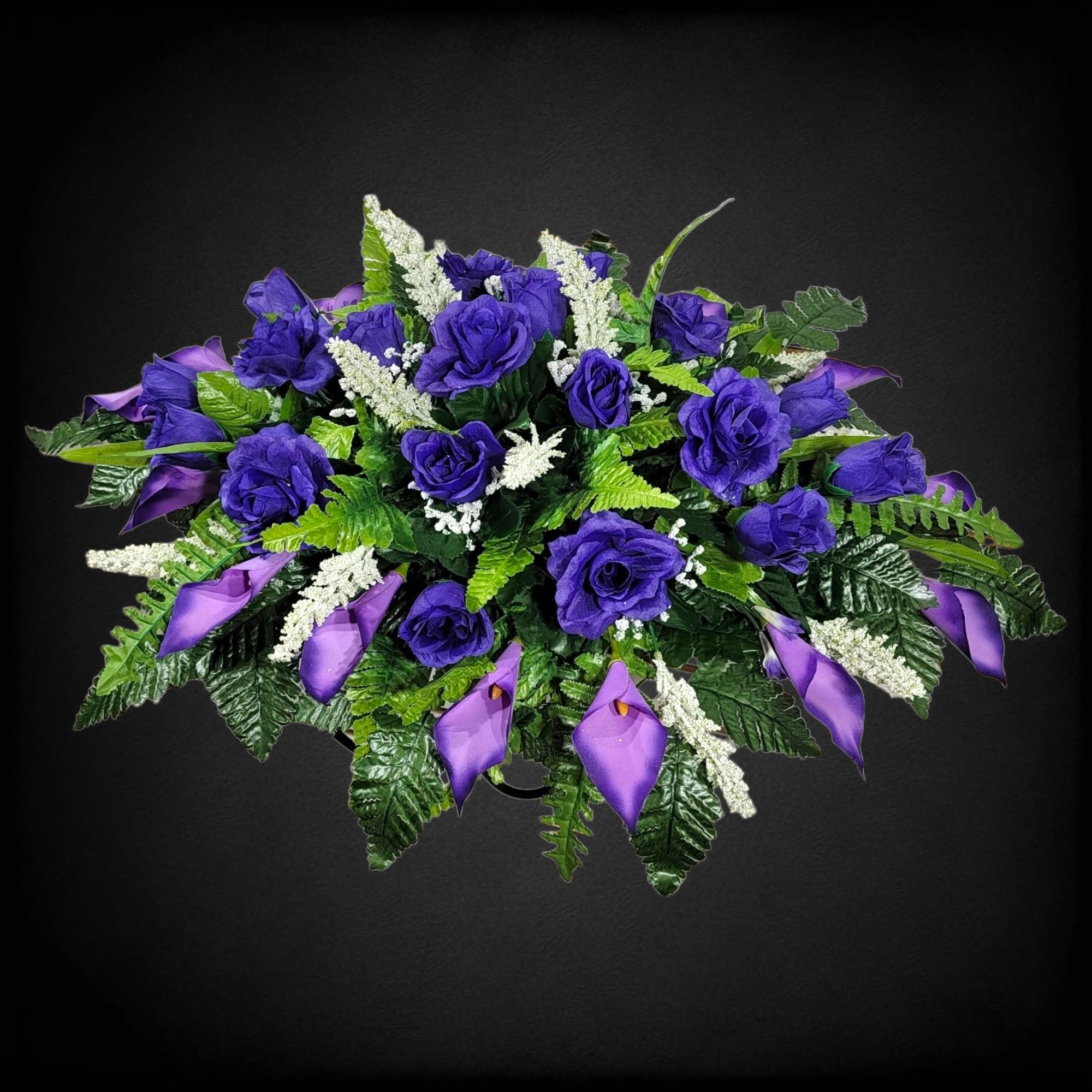Handmade floral saddle by designers securing to grave marker