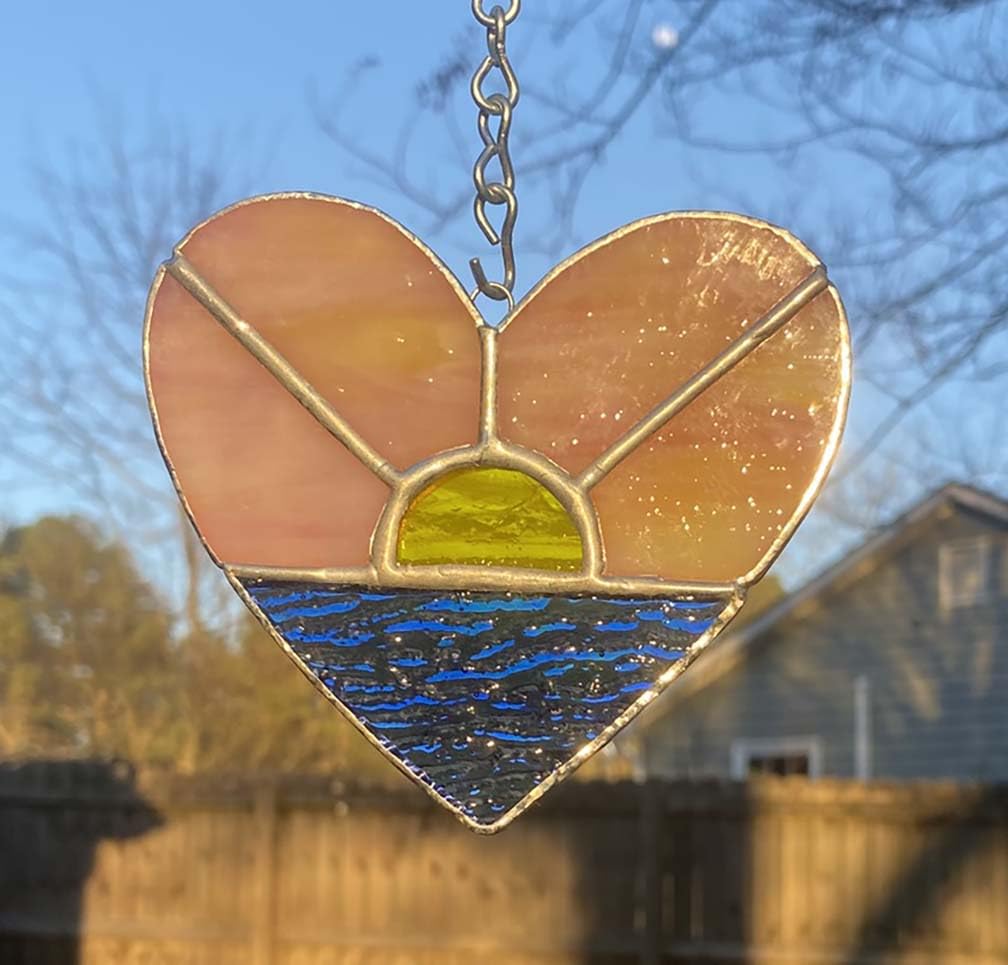 Heart shaped stained glass ornament handmade pink yellow sunrise