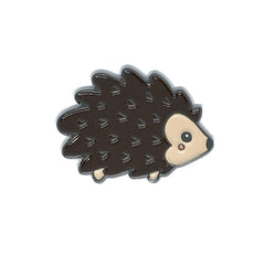 Hedgehog enamel needle minder on fabric ready for stitching