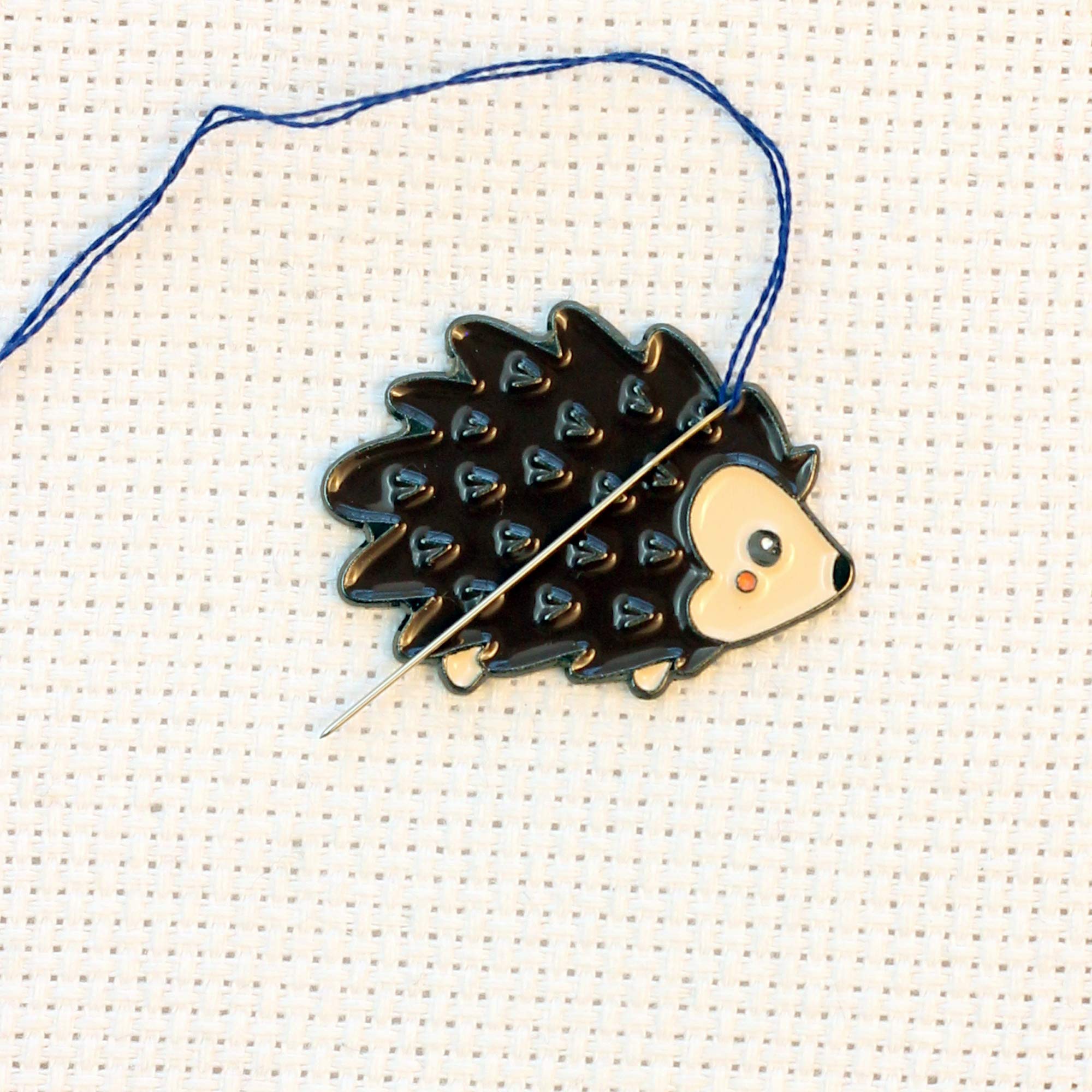 Hedgehog needle minder used as fridge magnet or wearable accessory