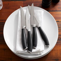 Four 4.5 inch Henckels Elan steak knives satin blades