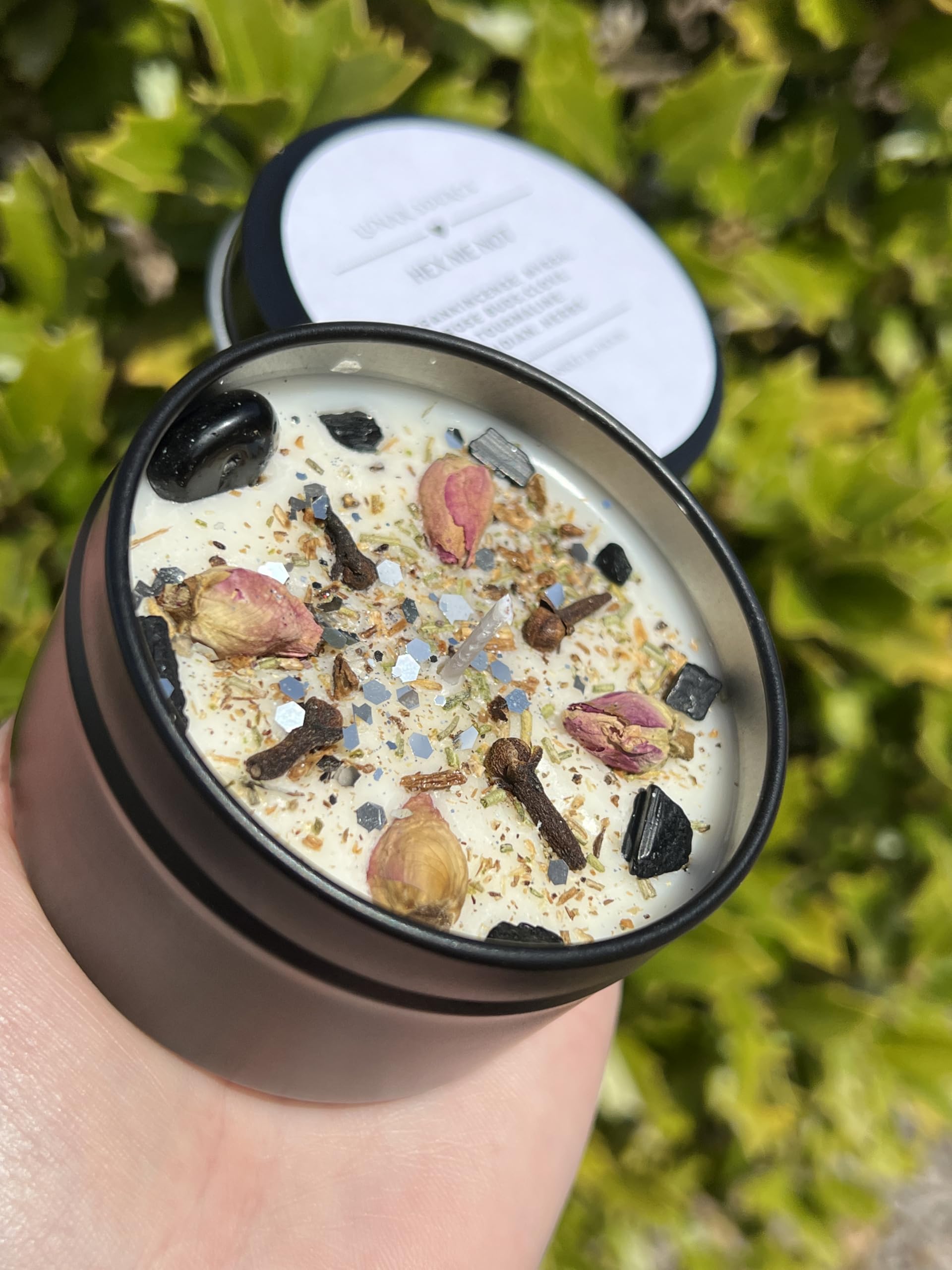 Candle topped with Black Tourmaline chips and Rose Buds cloves