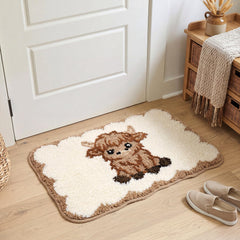 Brown white Highland cow bathroom mat with scalloped edge
