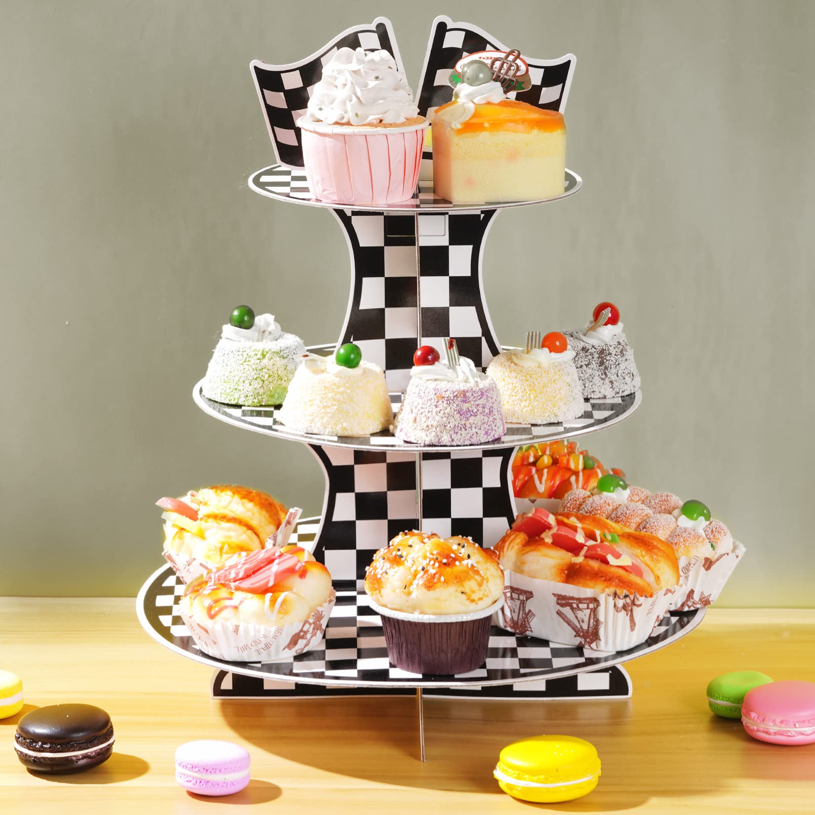 Display stand holding cupcakes and snacks for party