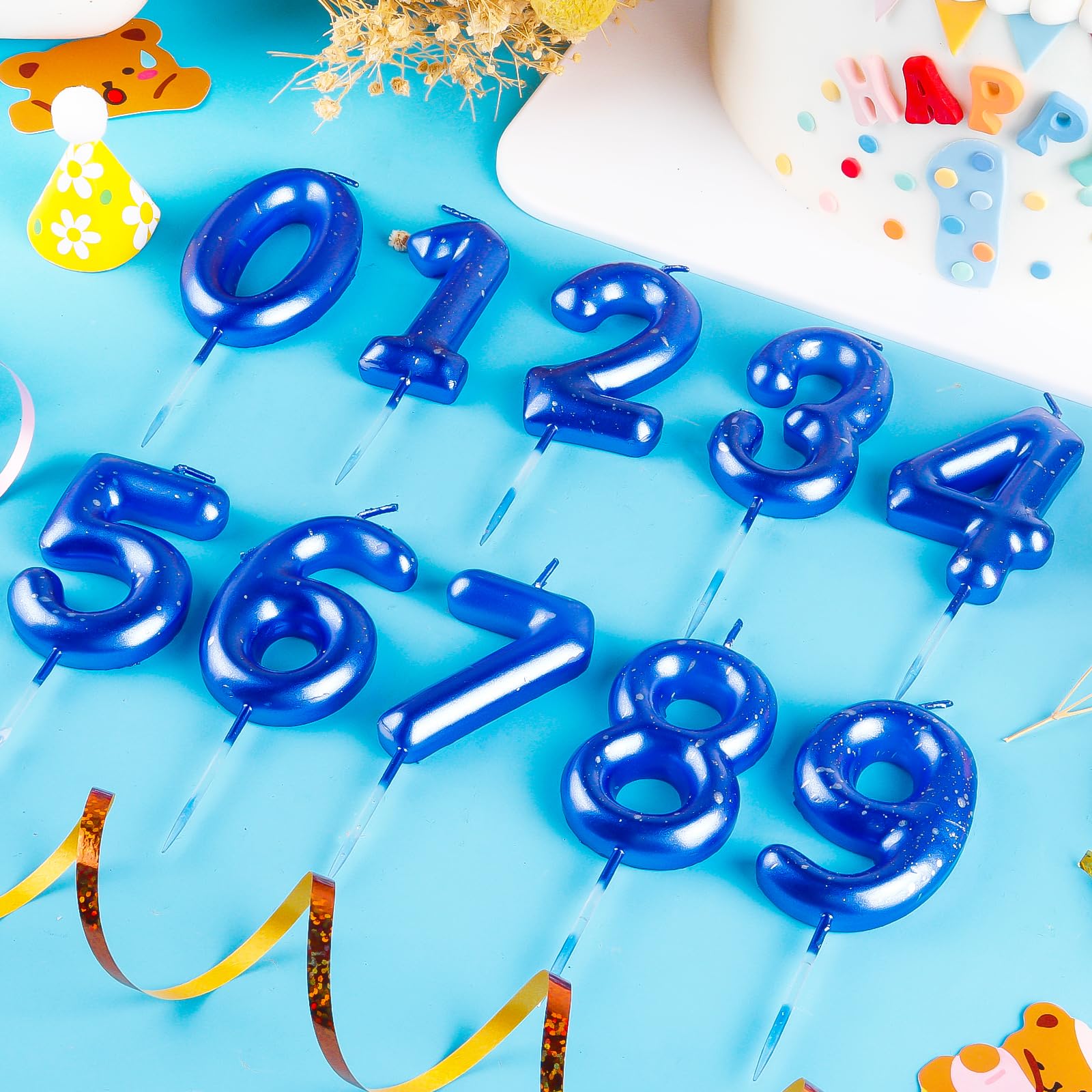 Blue theme birthday candles with silver accents for cake decoration