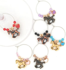 Three color toned horse charms on silver-tone rings with tiny hearts