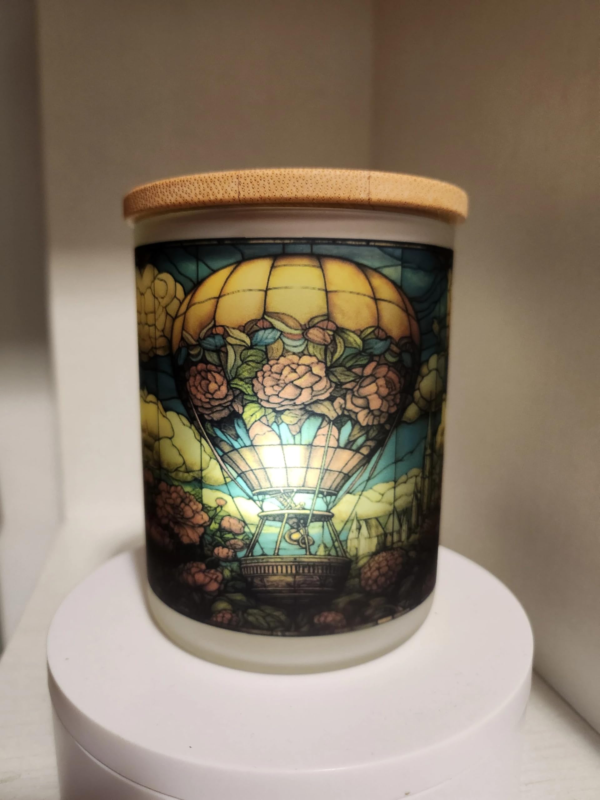 Four inch tall glass jar tea light holder with balloon motif