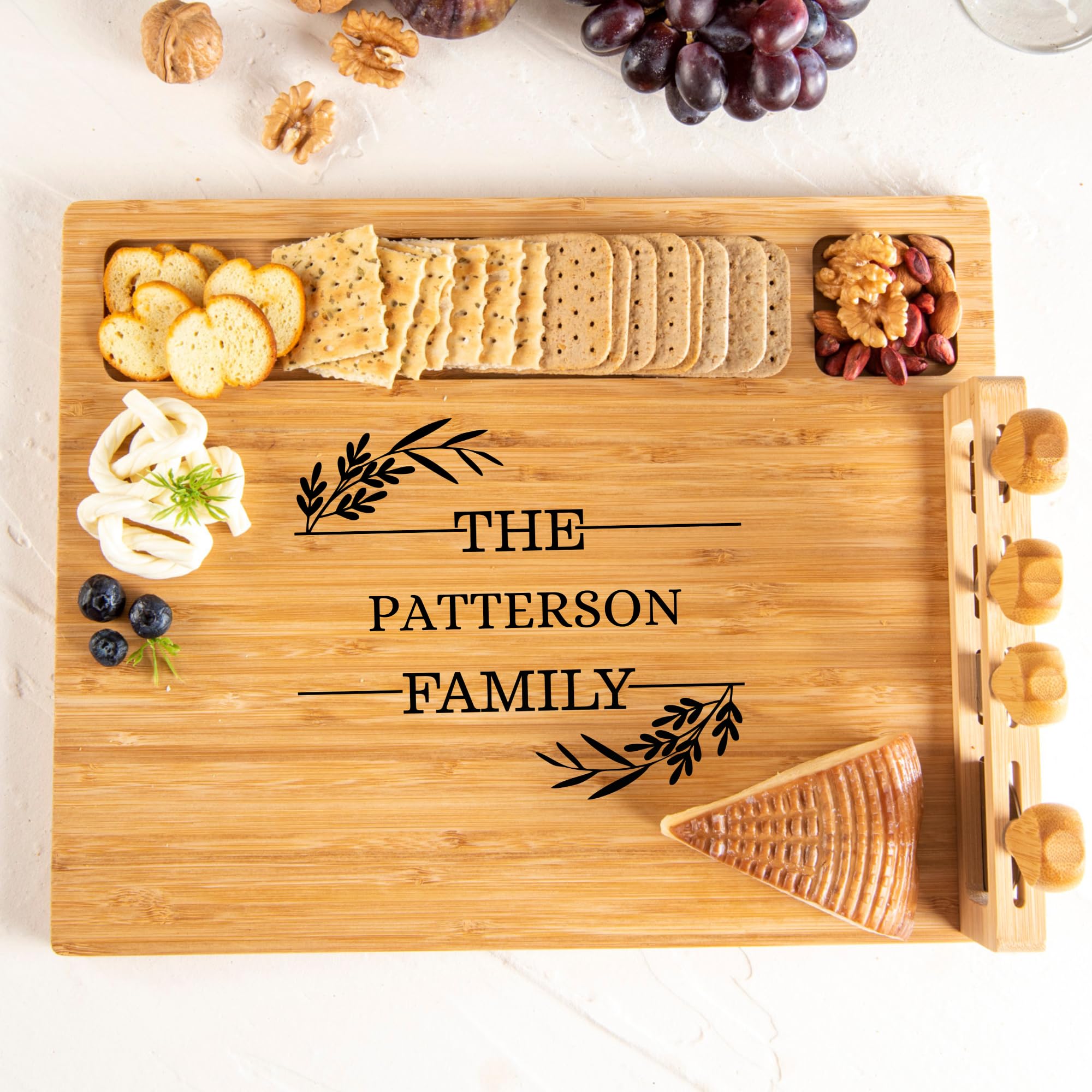 Housewarming bamboo charcuterie board on table