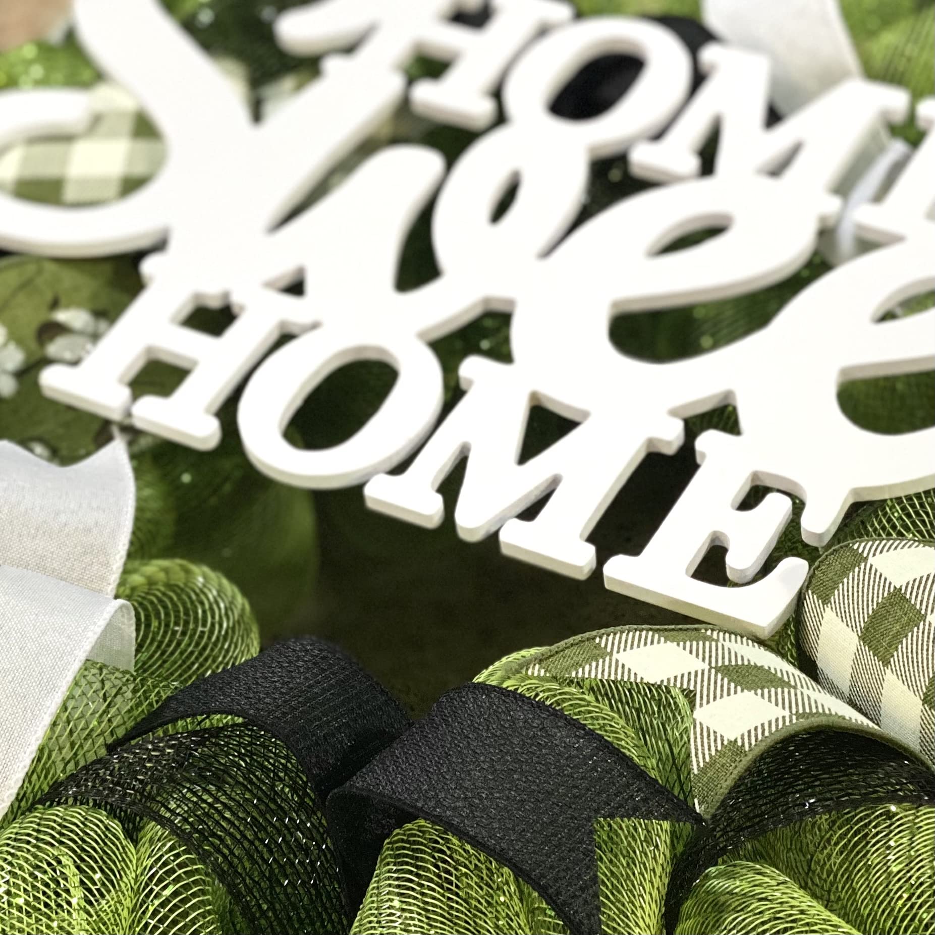 Indoor outdoor wreath with shelter from elements to stay pristine