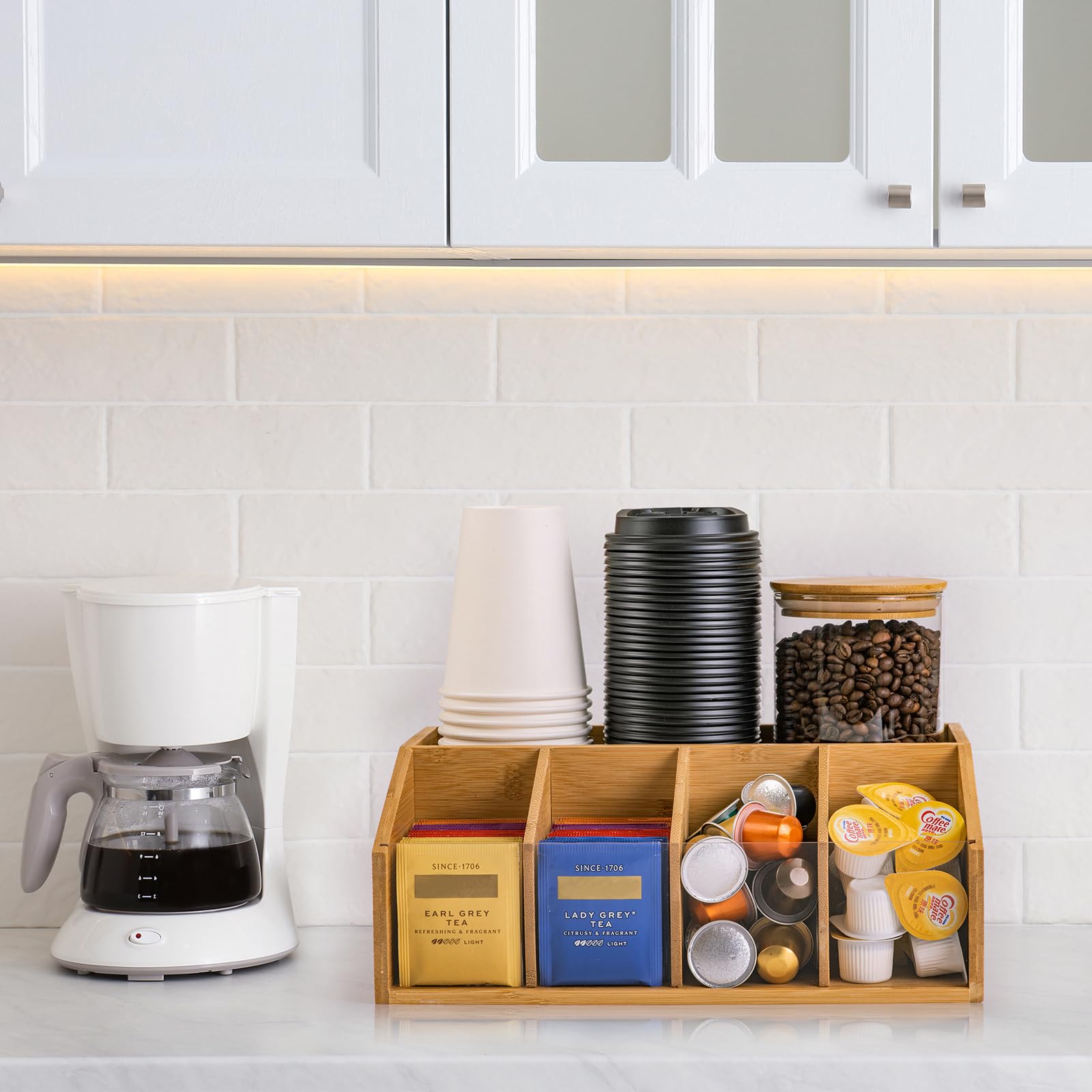 Clear acrylic divider inside coffee station organizer