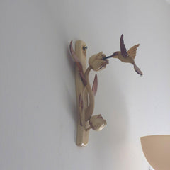 Hummingbird and tulip flower carving with burgundy and natural wood tones