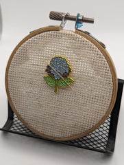 Needle rests on Hydrangea Needle Minder during a break