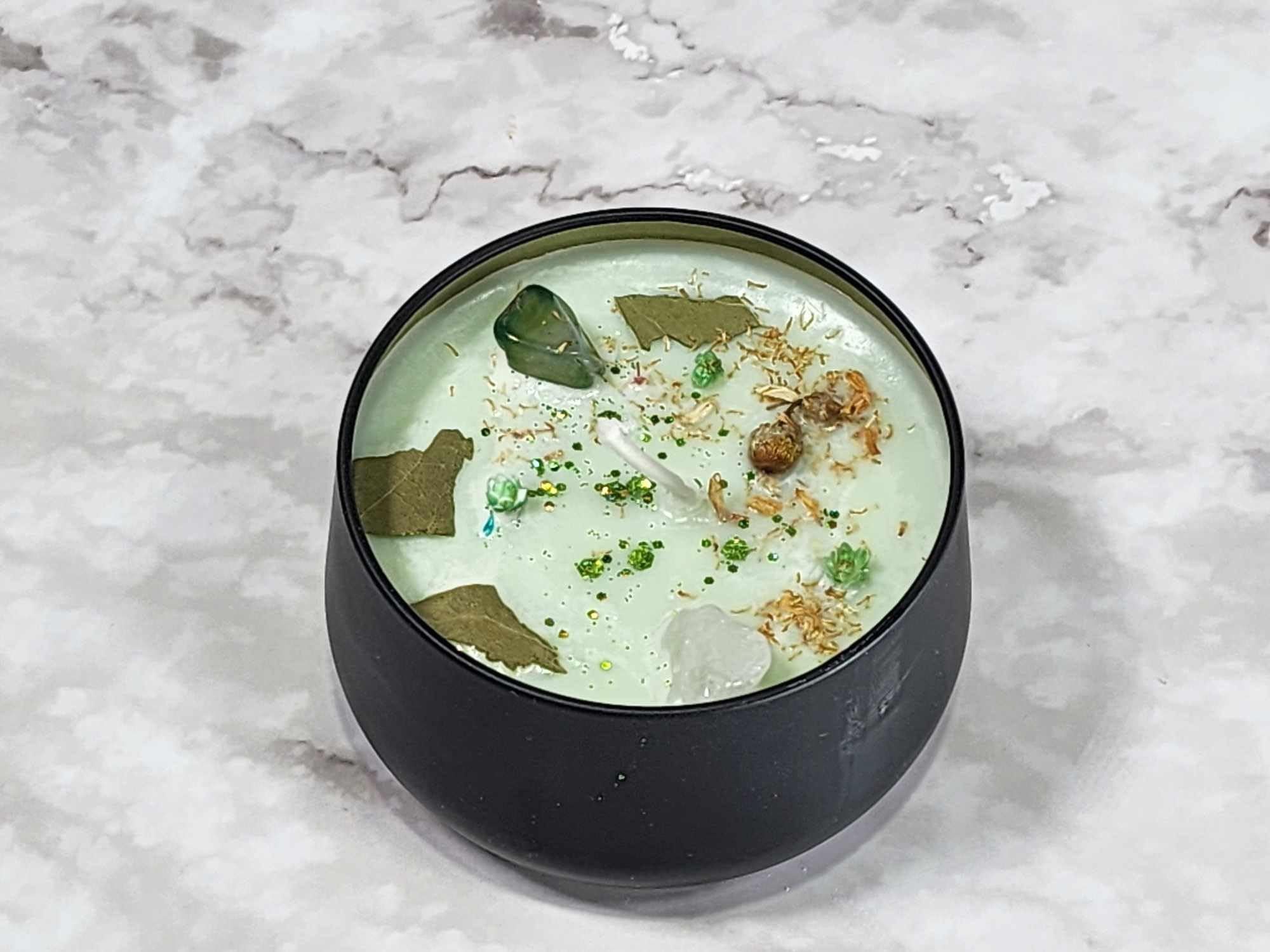 Candle infused with real herbs and crystals for Imbolt Sabbat