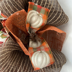 Wreath with Pilgrim hat turkey centerpiece and ribbons