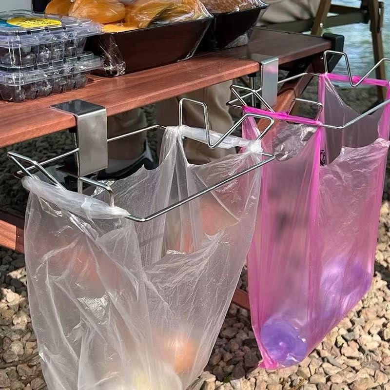 Portable trash bag holder clipped to a table edge
