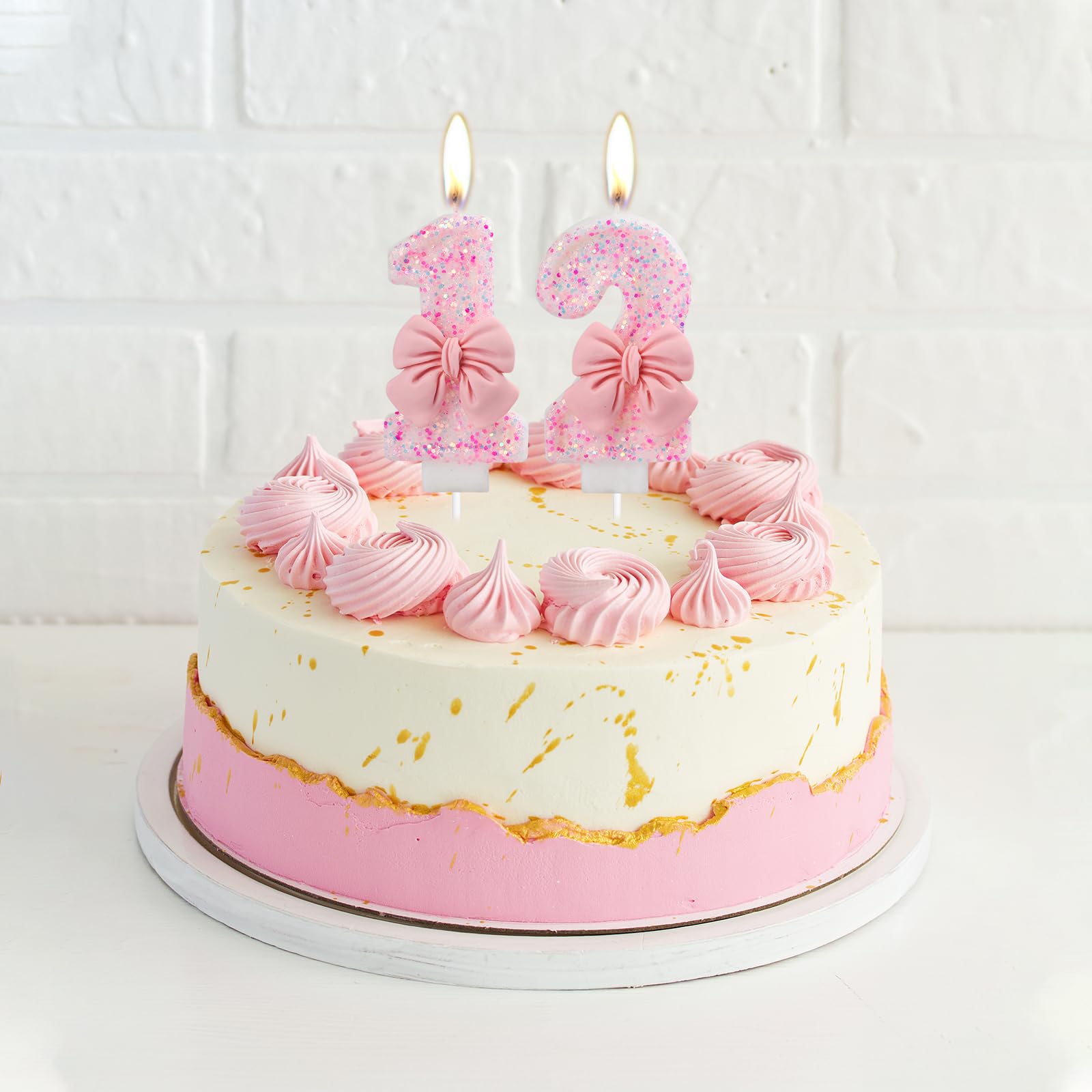 Two-pack pink bow birthday candles for cake decorating
