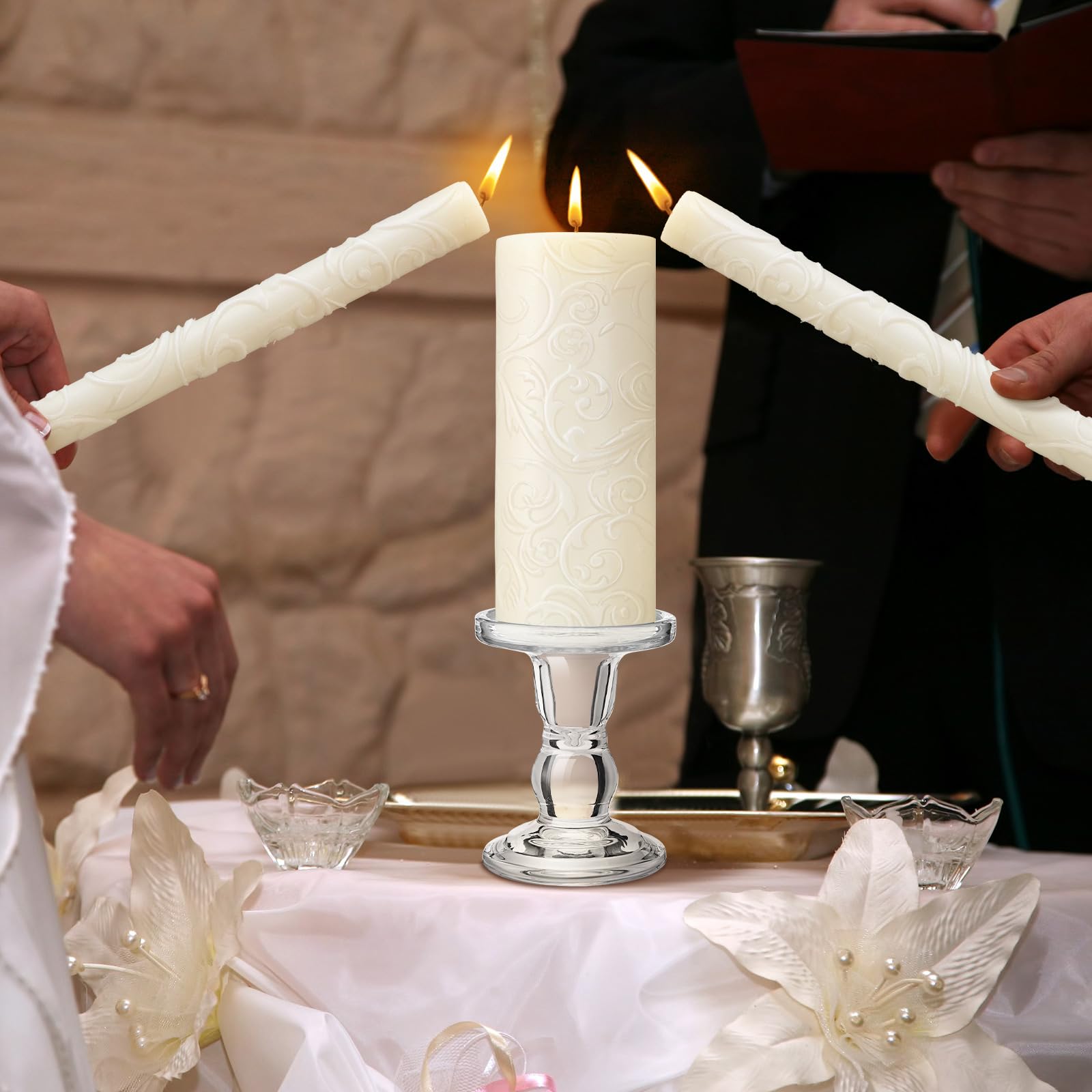 White wax unity candles and clear glass candle holder