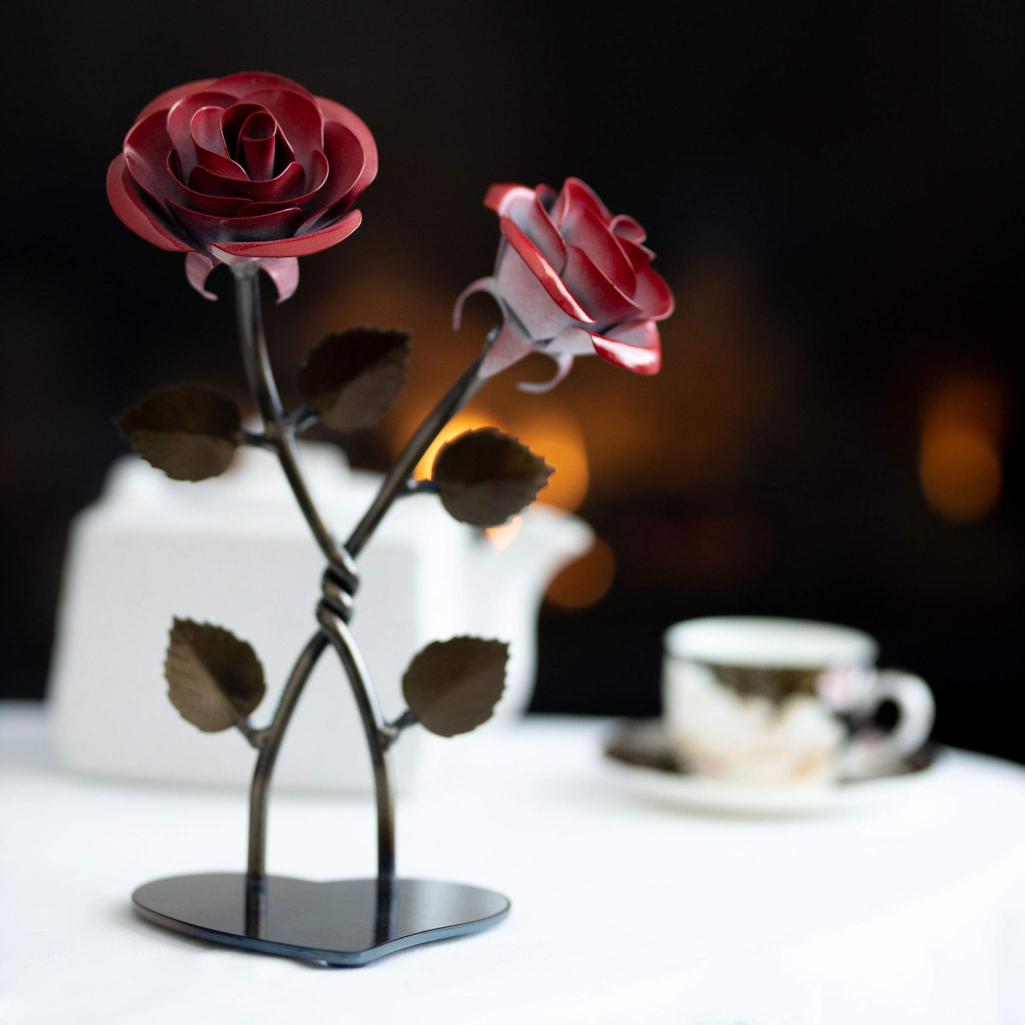 Iridescent shine on iron rose sculpture