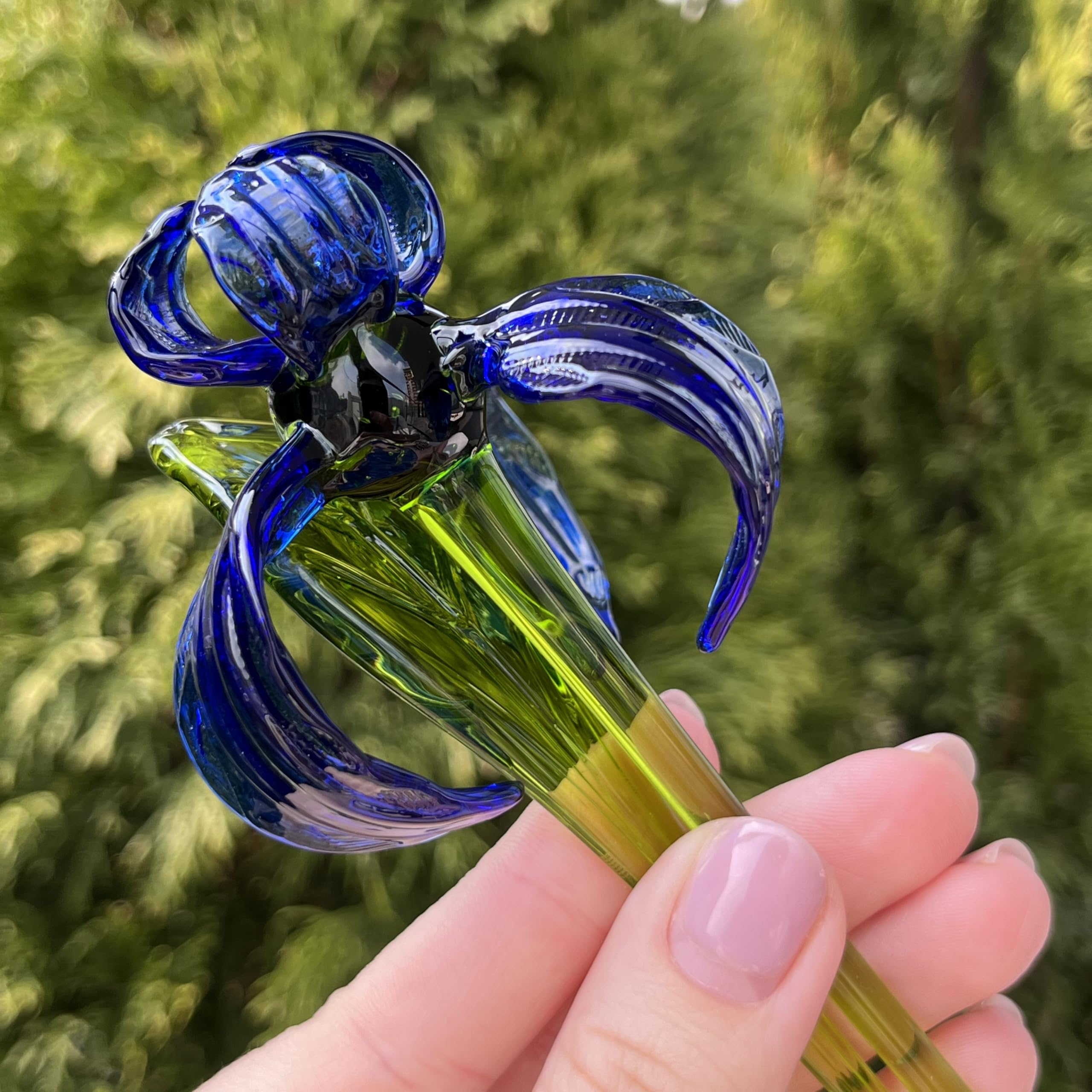 Iris glass figurine on shelf for display