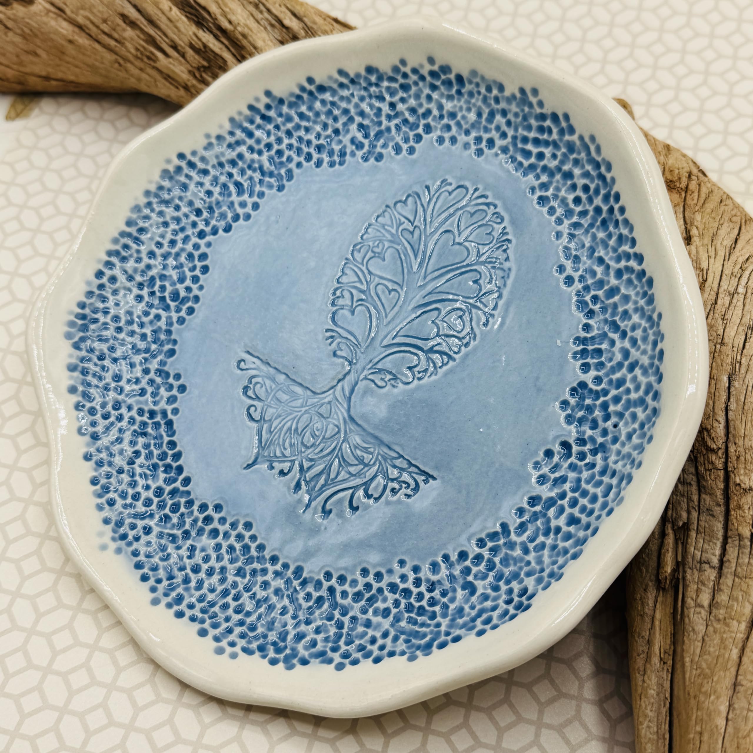 Free form pottery dish with tree of hearts design by JANECKA