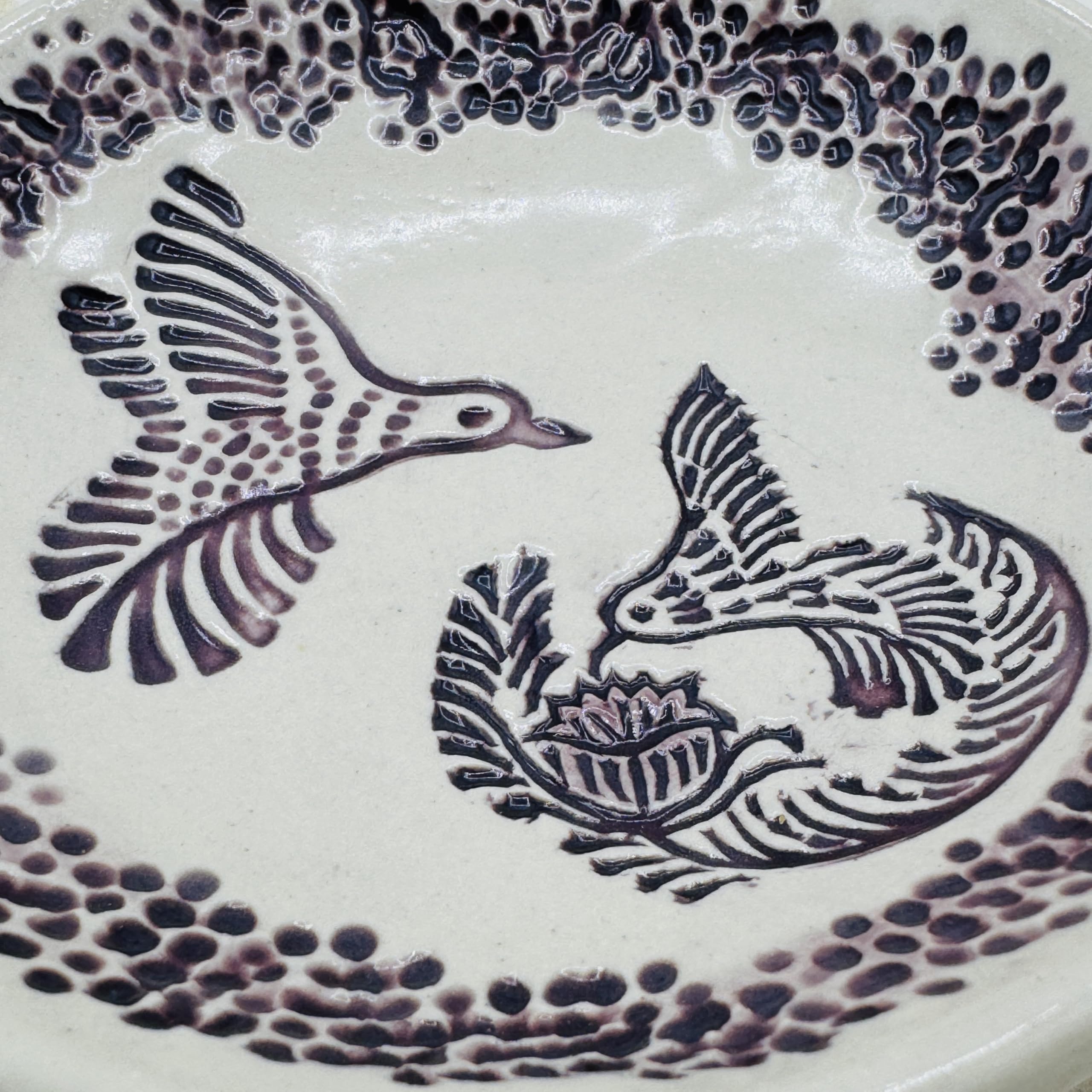 Free form pottery bowl with handmade marks
