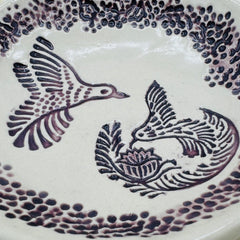 Free form pottery bowl with handmade marks