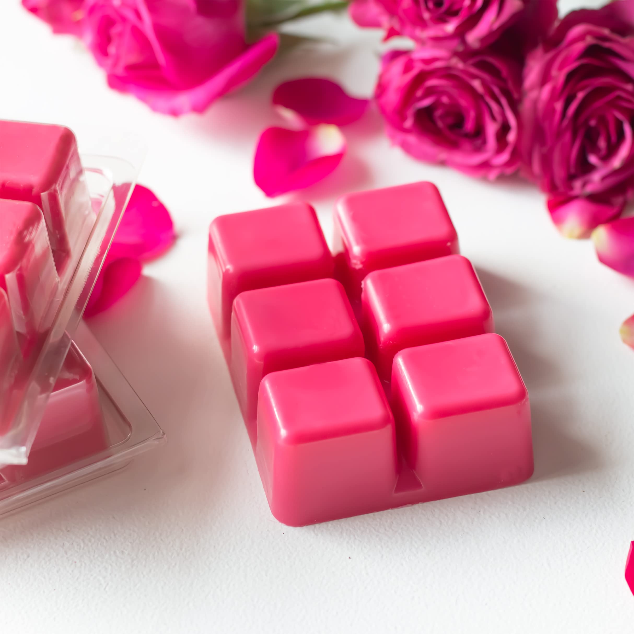 Clamshell contains 6 one-inch wax cubes in deep pink color