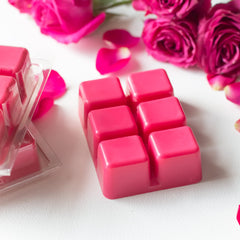 Clamshell contains 6 one-inch wax cubes in deep pink color
