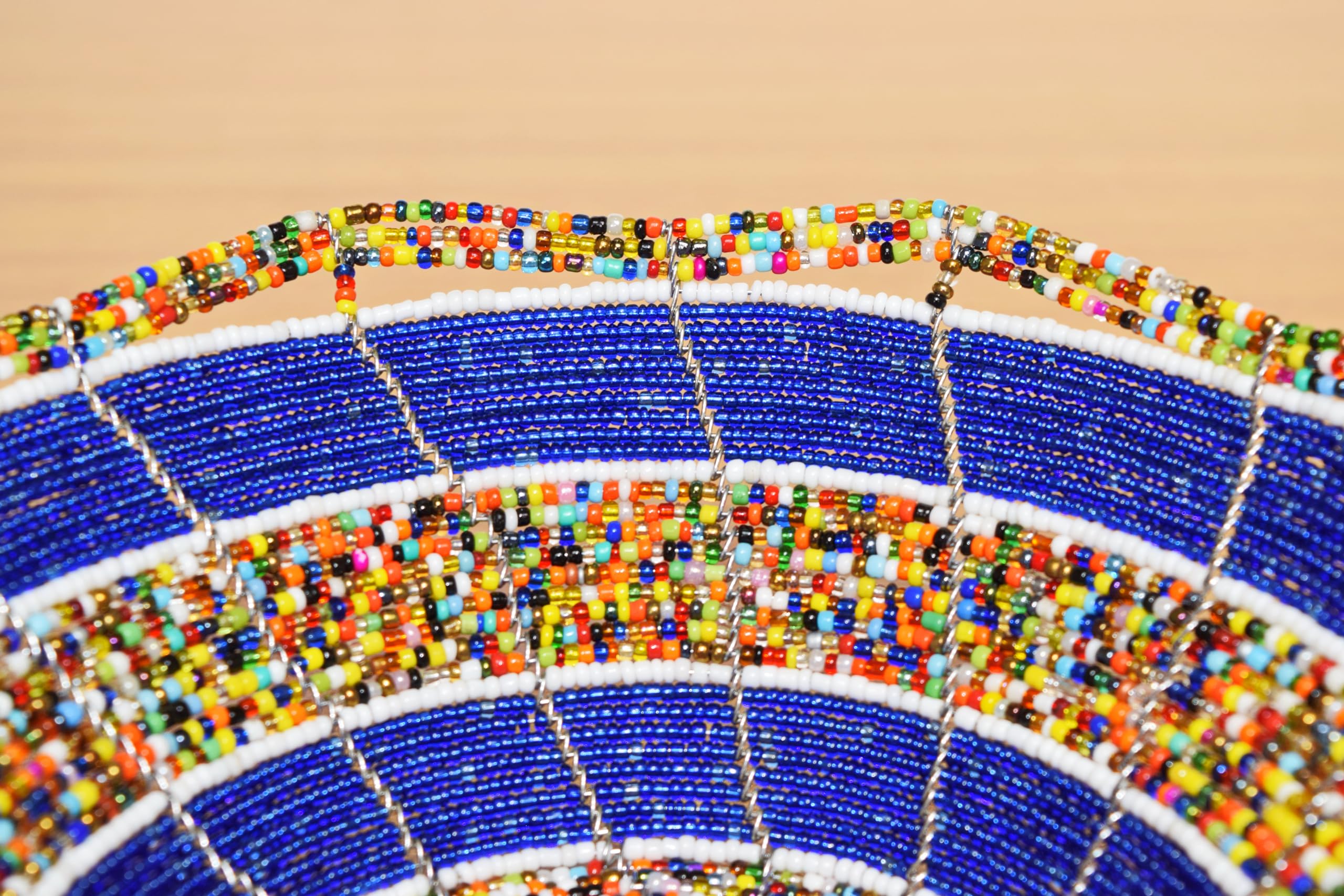 Fair trade beaded bowl displayed on table