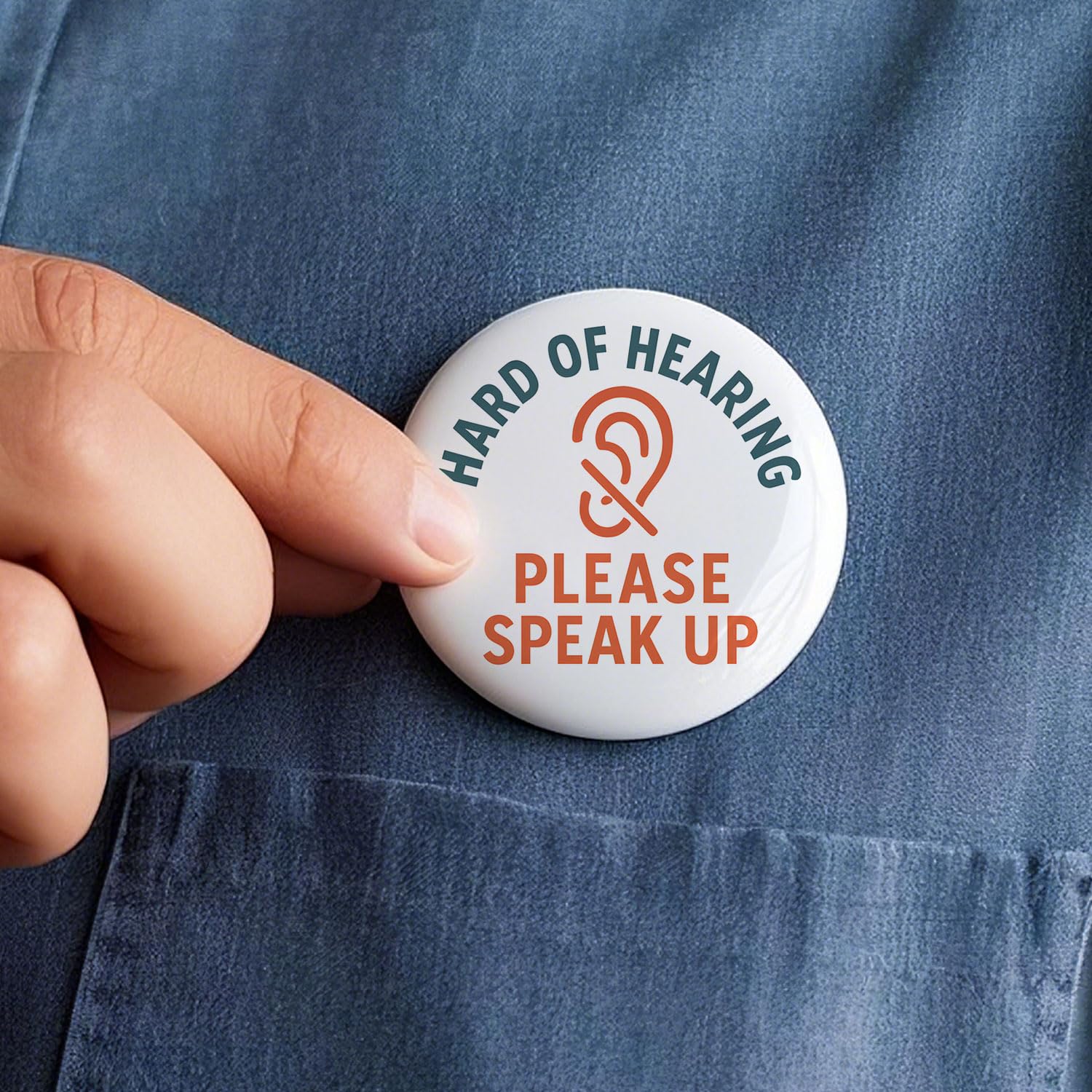 Hearing impaired alert button attached to backpack