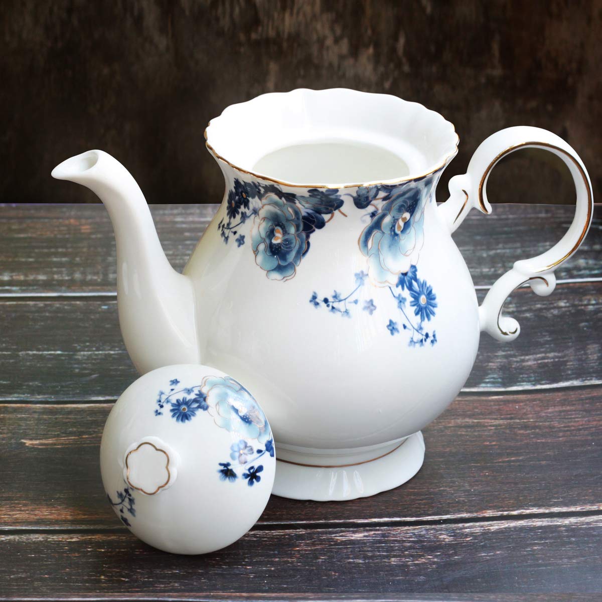 Porcelain teapot close up showing gold trim