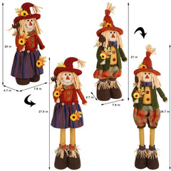 Female scarecrow in dress wearing sunflower hat