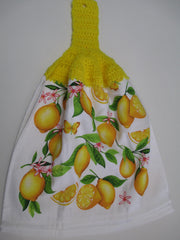 Towel with button for hanging on cabinet or oven handle
