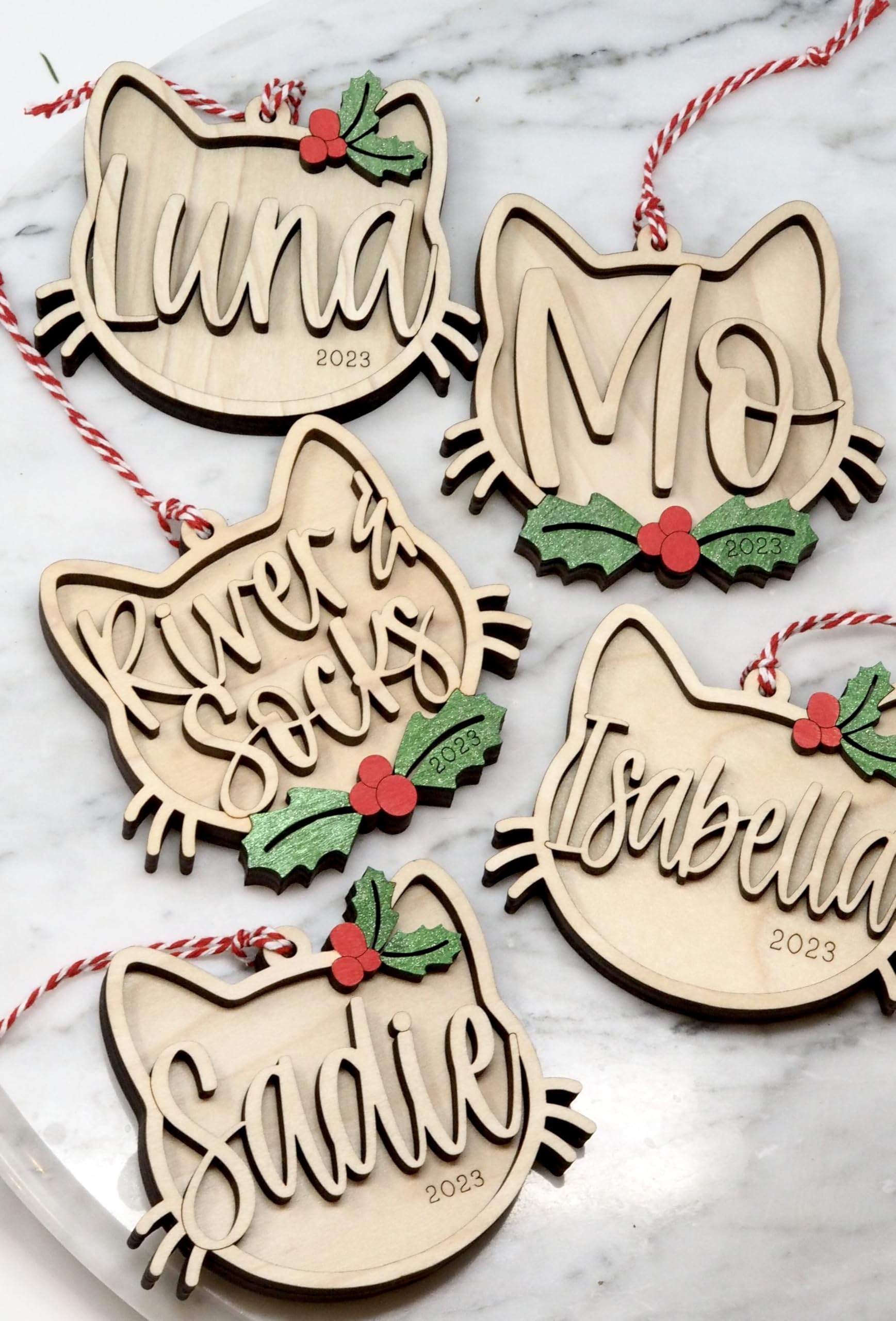 Kitten's First Christmas cat ornament with holly design