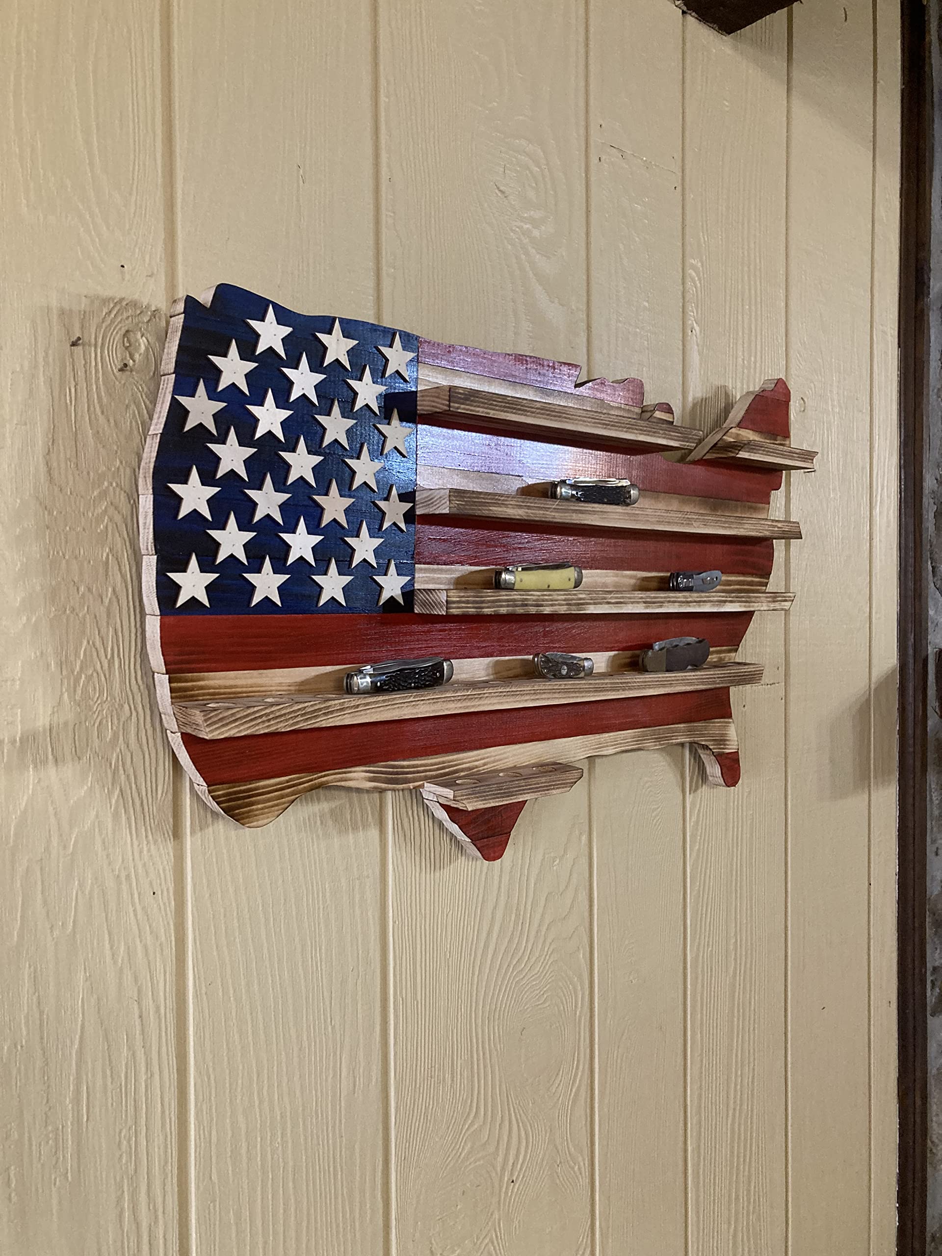 Wooden flag knife holder showing raised stars and burn-grain finish
