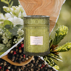 Close up of embossed daisy motif on LA JOLIE MUSE candle jar