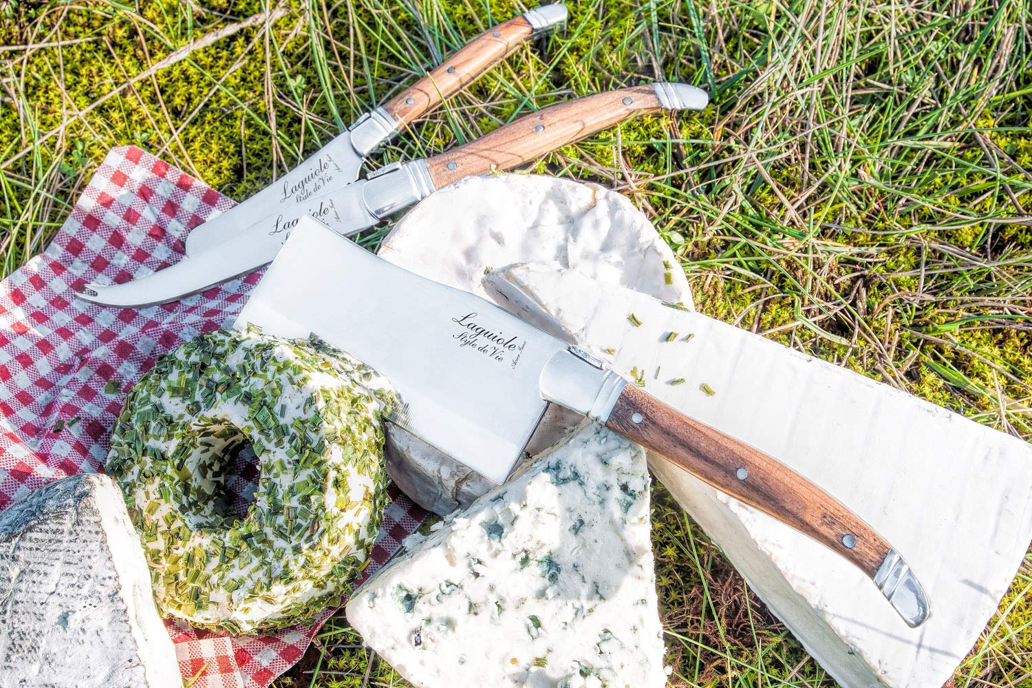 Close up olive wood handle on Laguiole Style De Vie cheese knife